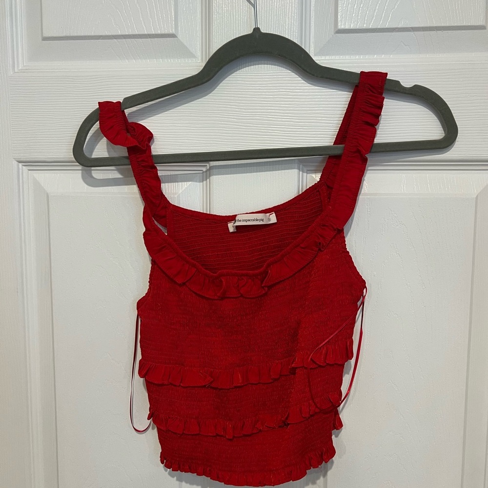 Red Cropped ruched top. Size small. In very good condition.